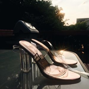 Clear heeled heel with rose gold sole.